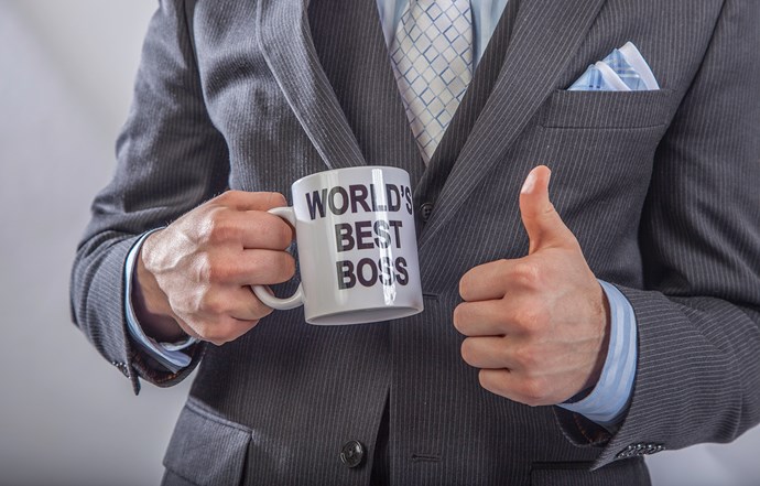 Holding &quot;World&#39;s Best Boss&quot; mug