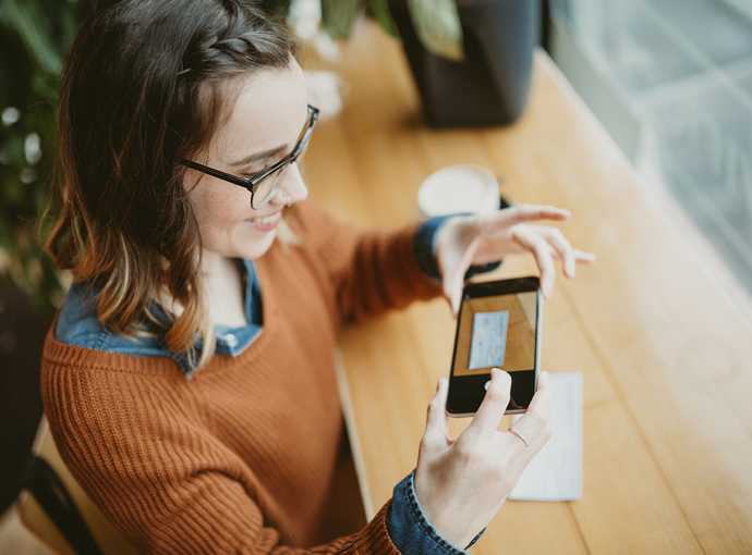 Woman depositing a check with her smartphone