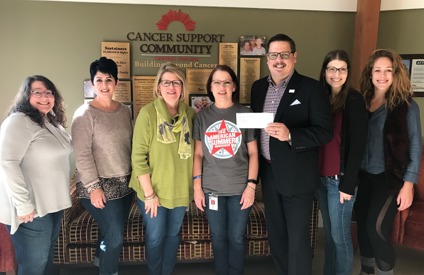 Elements makes a gift to the Cancer Support Community