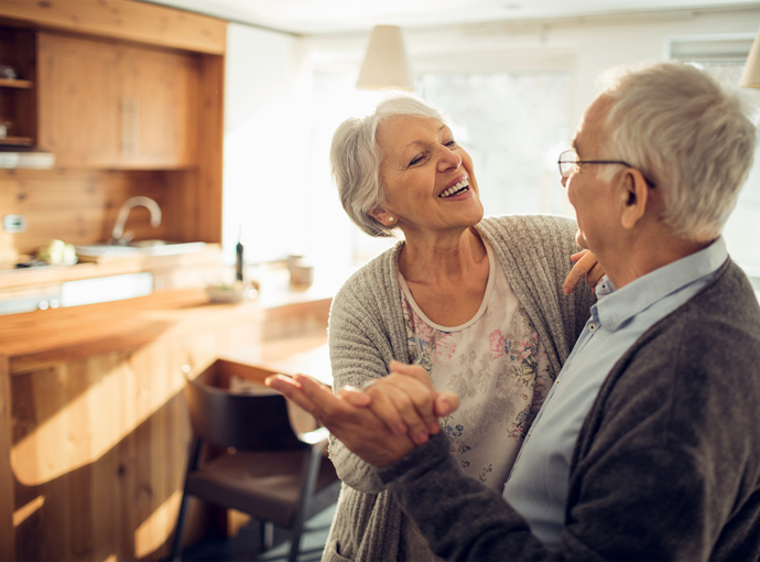 Couple laughing in their home