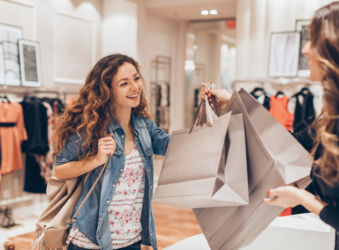 Female holding shopping bags in store