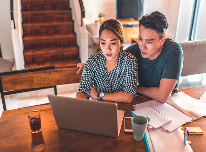 Couple looking at desktop computer