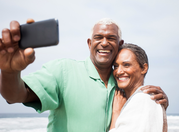 Couple taking selfie on the beach