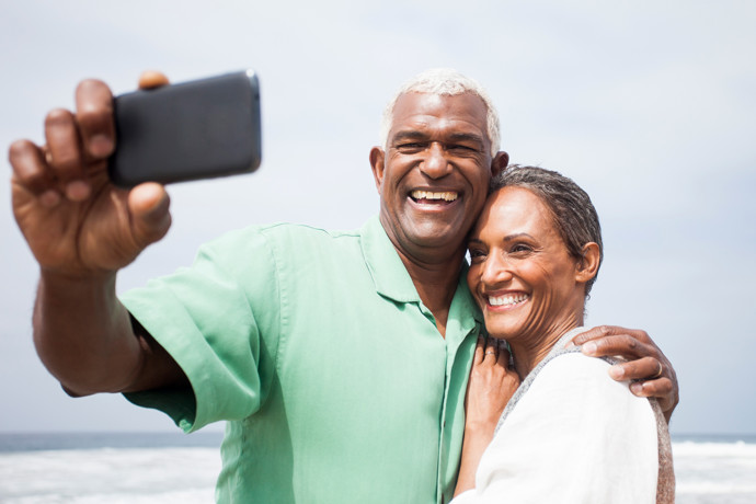 Couple taking selfie on the beach