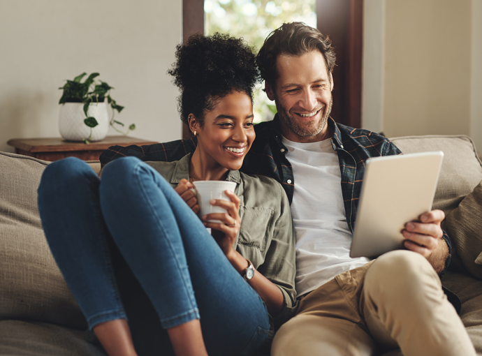 A couple watching a webinar