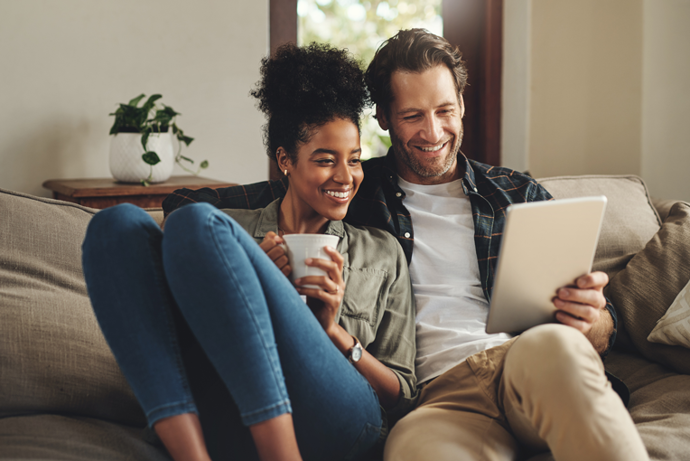 A couple watching a webinar
