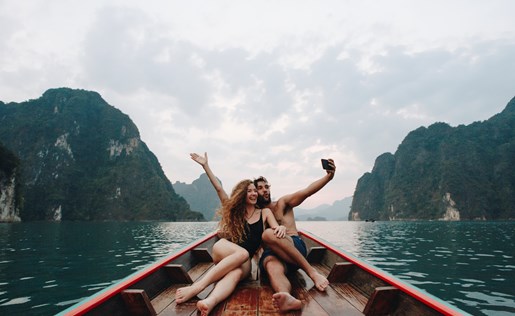 Friends on a boat in a remote part of the world