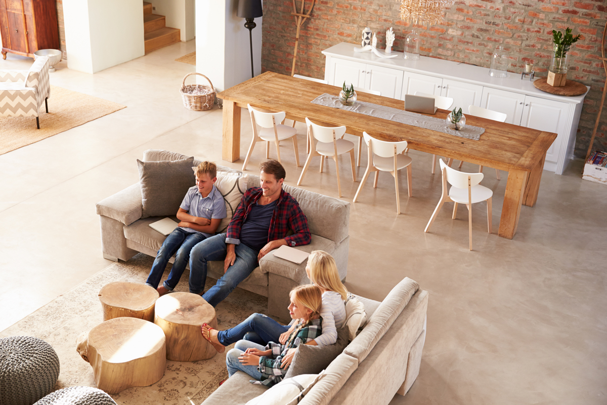 Family in living room watching television.