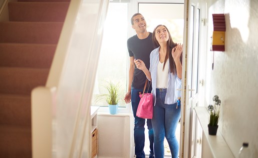 New homeowners walking into their new home