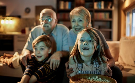Grandparents and grandkids watching television