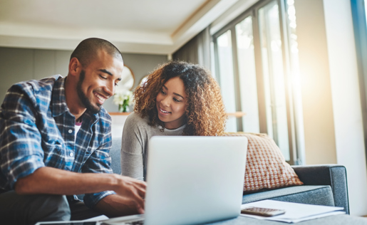 A couple using Elements budgeting tools on their laptop