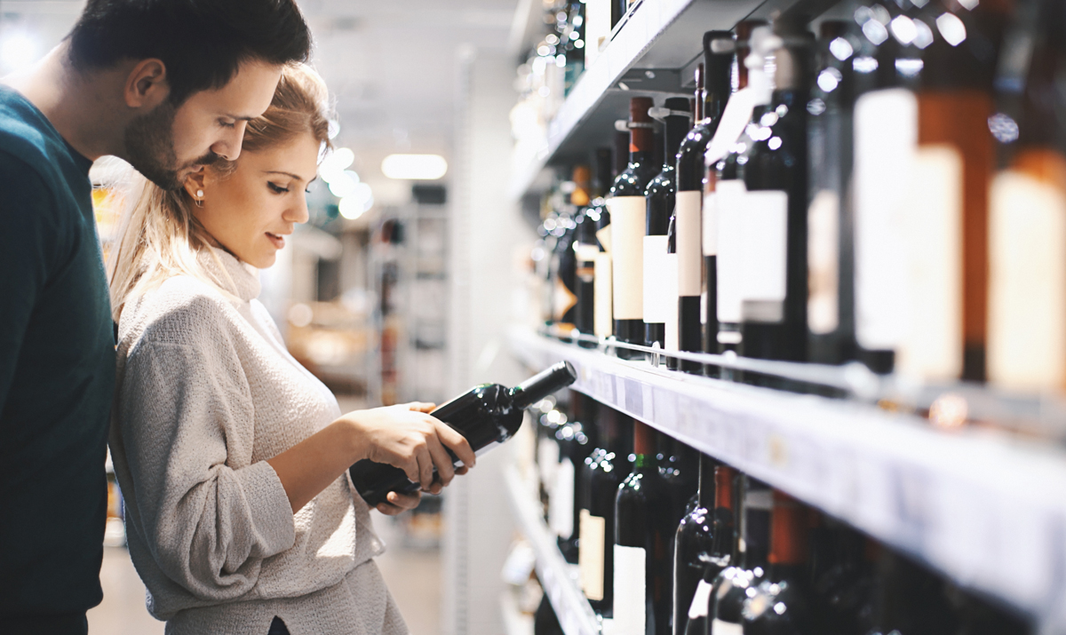 Couple buying some wine.