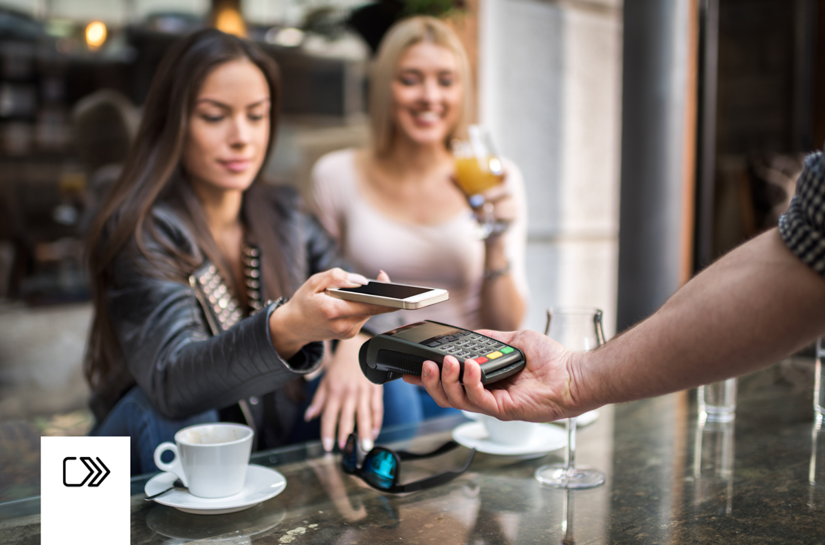 Woman paying with her digital wallet.