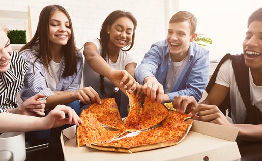 A group of friends sharing a pizza