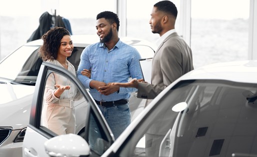 A couple buying a new car