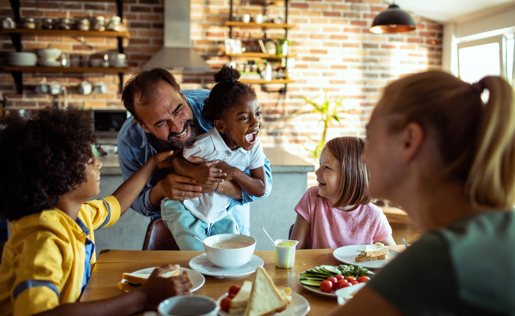 A family playing while eating lunch at a cafe