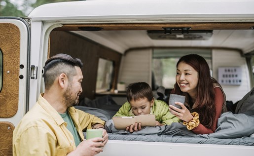 Family of three lounging in their RV