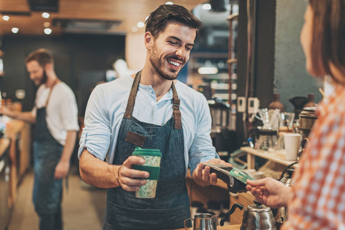 Man buying coffee at Starbucks