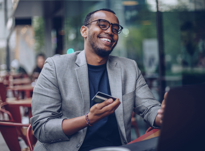 Man happily doing online banking
