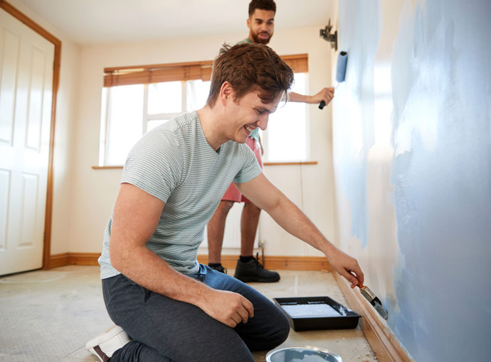 A couple working on their home together.