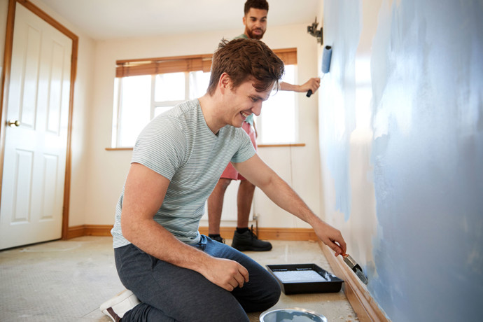 A couple working on their home together.