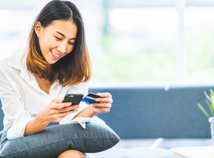 Woman happily doing online banking