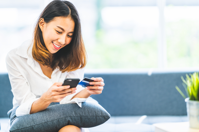 Woman happily doing online banking