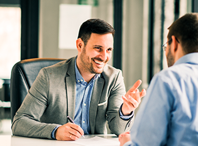 Man speaking with his financial advisor.