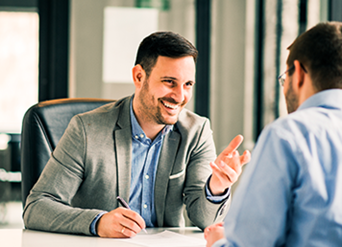 Man speaking with his financial advisor.
