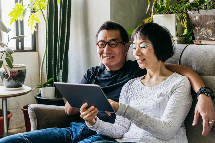 A couple using a tablet together.
