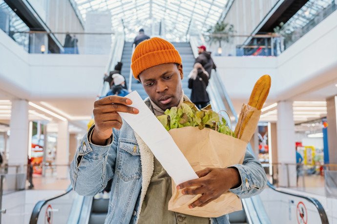 Looking at receipt after shopping