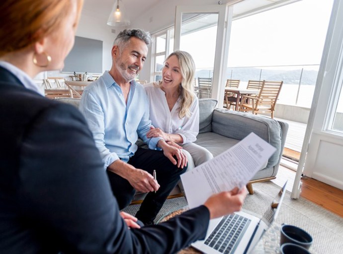 A couple talking to their insurance advisor.